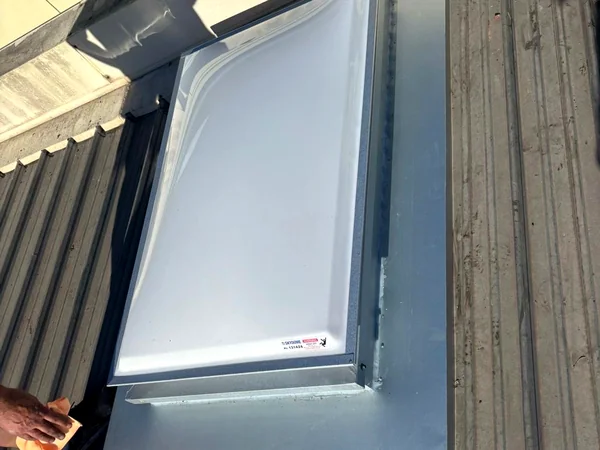 Skylight installed into a new metal roof