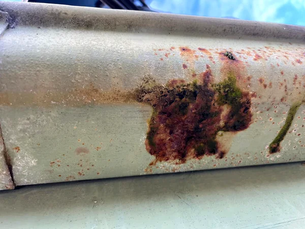 Guttering rusted through at the seam, ready for replacement